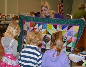 BHQG Member demonstrating quilting to future quilters